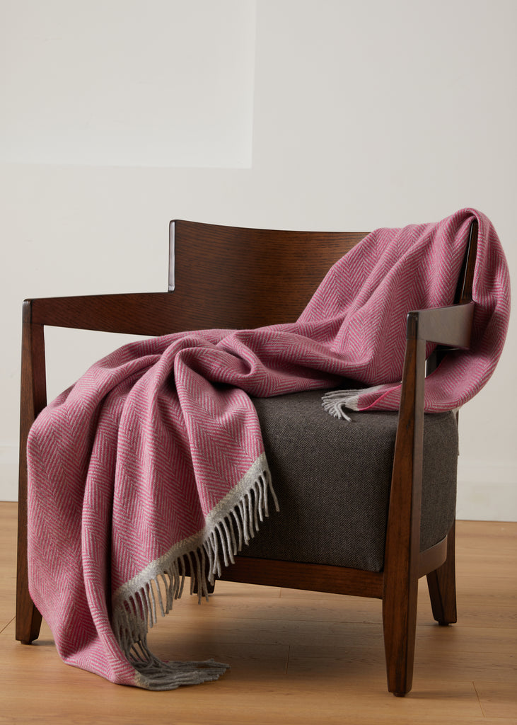 Foxford Croía pink Cashmere and Lambswool Throw on a chair