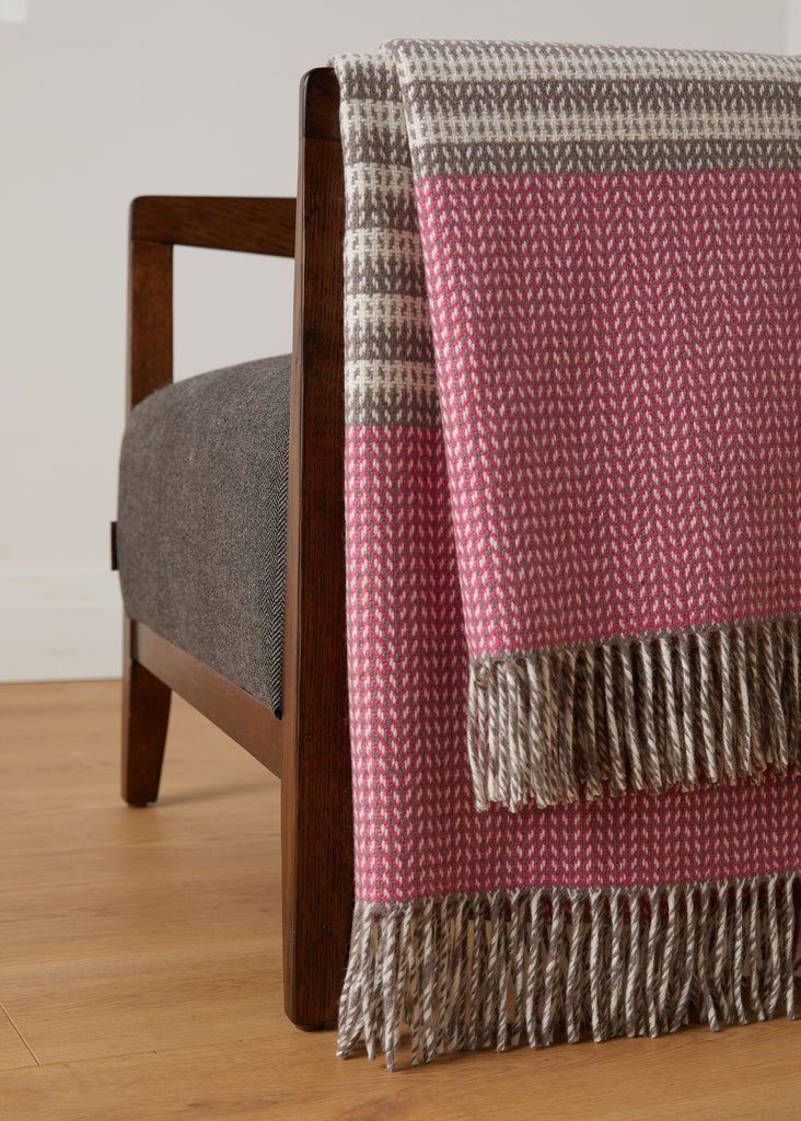 Foxford Ella Cashmere and Lambswool Throw pink and mink throw on a chair