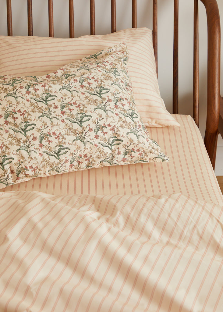Experience pure luxury with Foxford's Romantic Stripe Fitted Sheet, part of our 180-thread count Everyday Collection. Combining beautiful peach and pink tones with a repetitive ticking pattern adds elegance to any bedroom. Made in Portugal with 100% long-staple cotton and designed by renowned Irish designer Helen McAlinden, it promises to bring the opulent cosiness and superb quality of Irish bedding to your home.