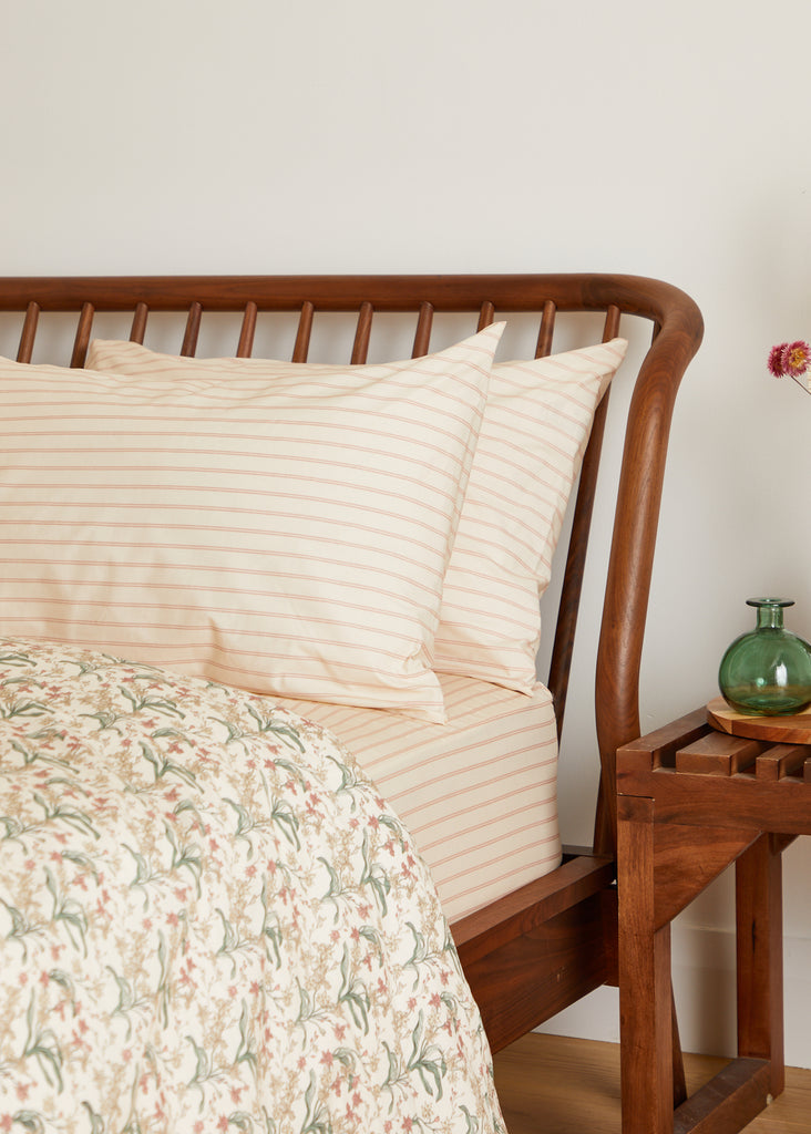 Introduce pure luxury with the Foxford Romantic Stripe Pair of Standard Pillowcases, part of our 180-thread count Everyday Collection. New for summer 2024, they feature a beautiful ticking pattern in peach and pink hues. Meticulously made in Portugal with 100% long-staple cotton and designed by acclaimed Irish designer Helen McAlinden, it guarantees the opulent cosiness and excellence of Irish bedding.